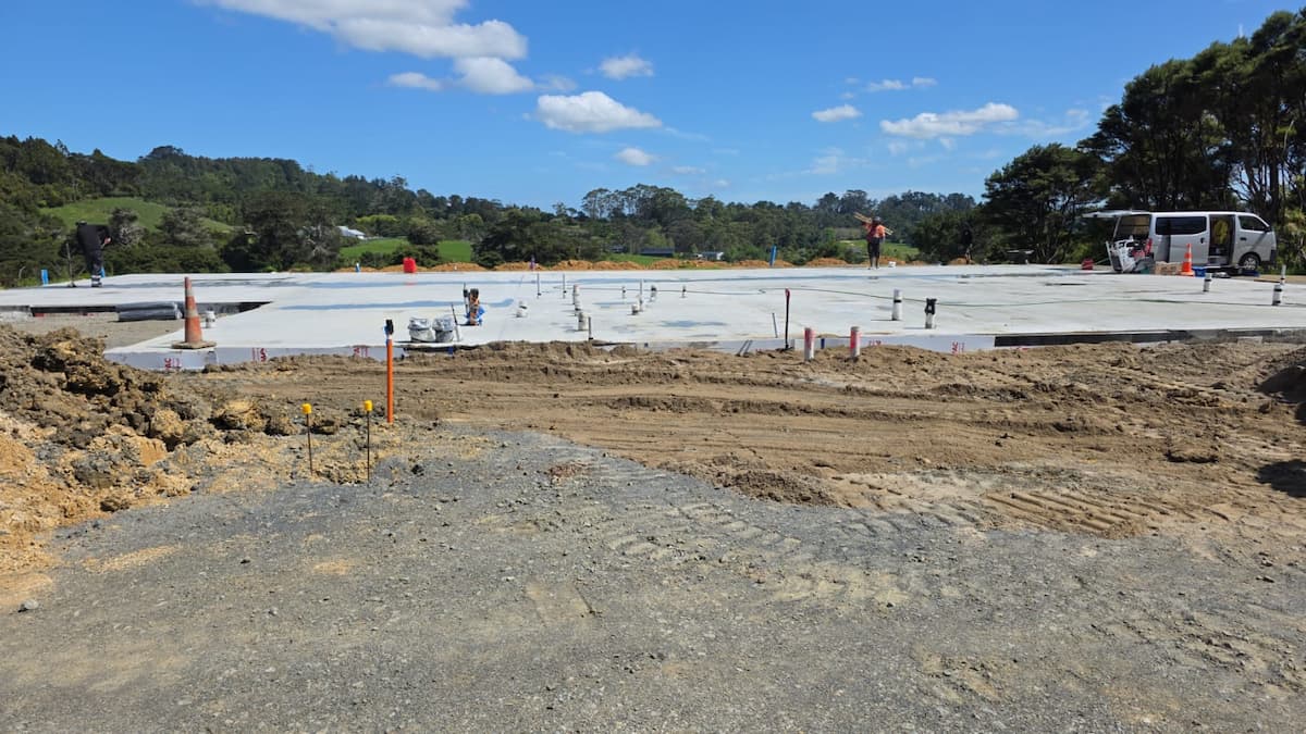 Photo showing the newly laid concrete foundation for the new clubhouse.
